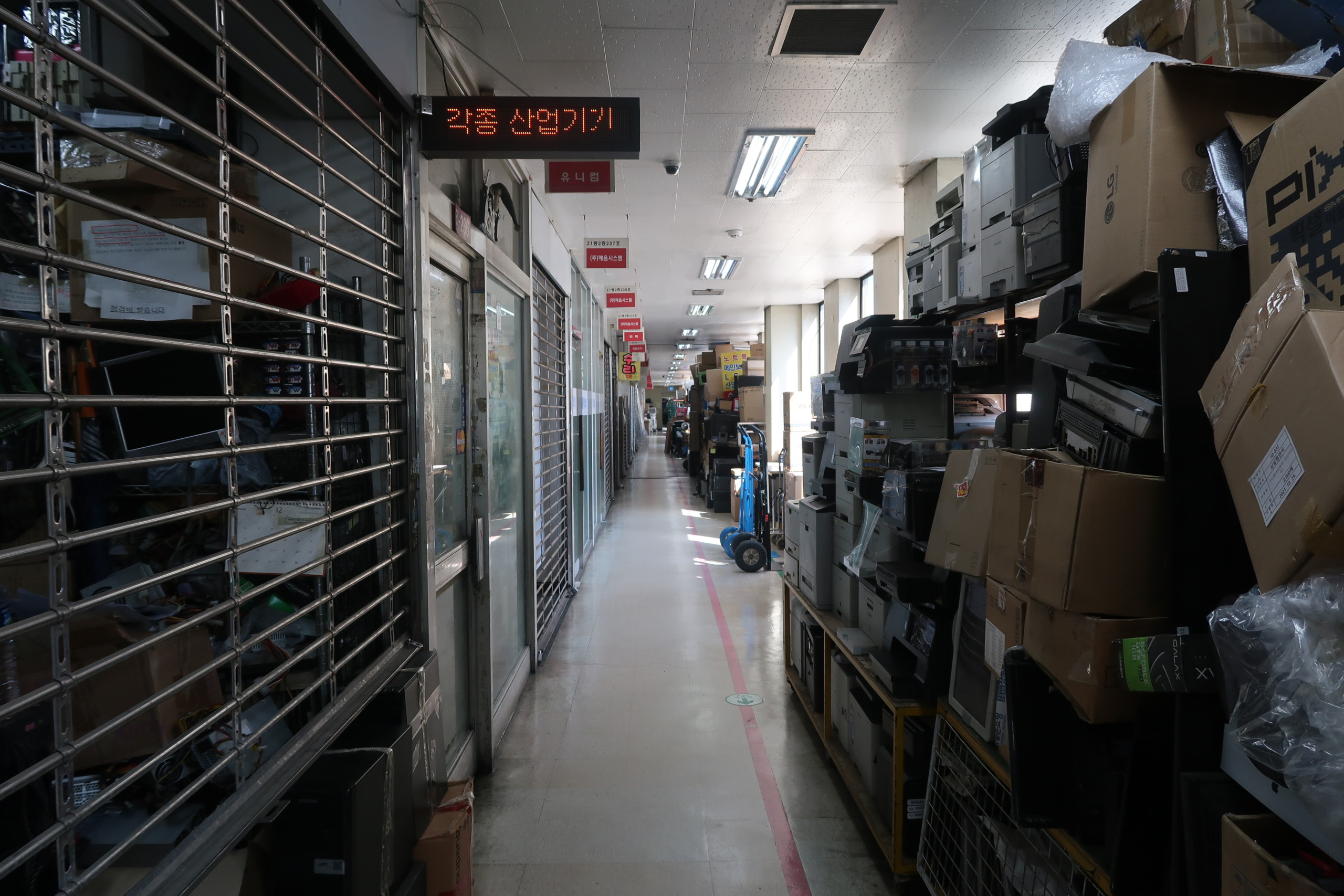 an alley in a electronics market building